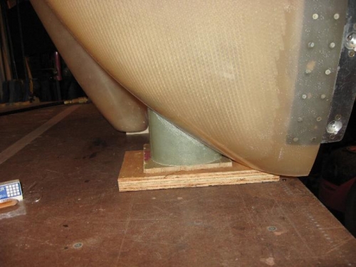 Cowling on it's end on the bench.  A sideview of the right vent protruding forward