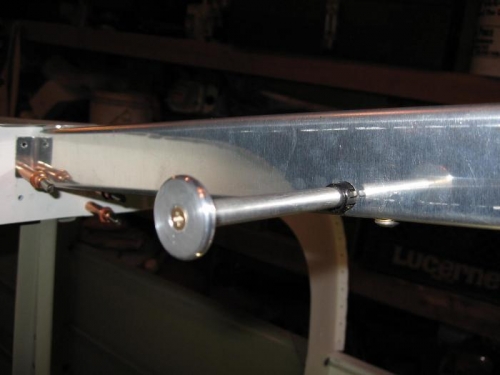 Each end is screwed into a #6 rivnut compressed into the end of the 5/16