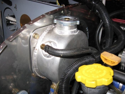 Coolant resevoir mounted to firewall