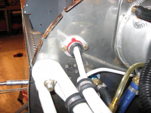 Firewall pass-thru for primary power wiring (firewall side)