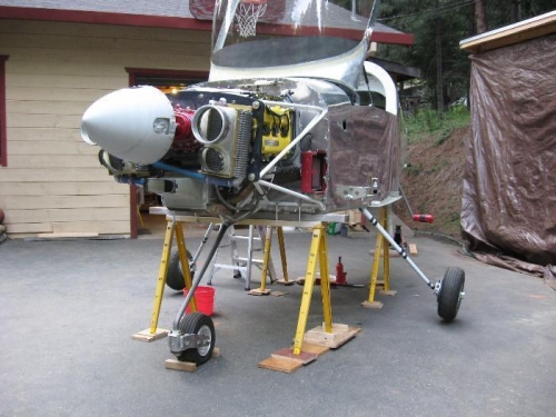 Jacked up and on the steel saw-horses.  Level left/right and fore/aft