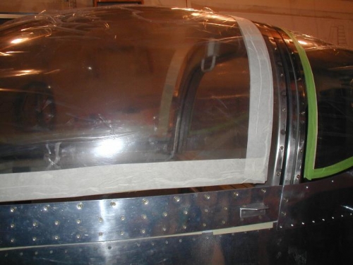 This view of the left also shows the small canopy handle to assist with raising canopy