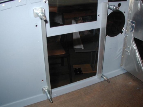 Vertical supports clecoed to the back of the panel