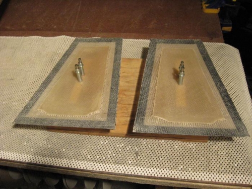 The flaps mounted to wood stand-offs to keep the outer surface up off the work bench.