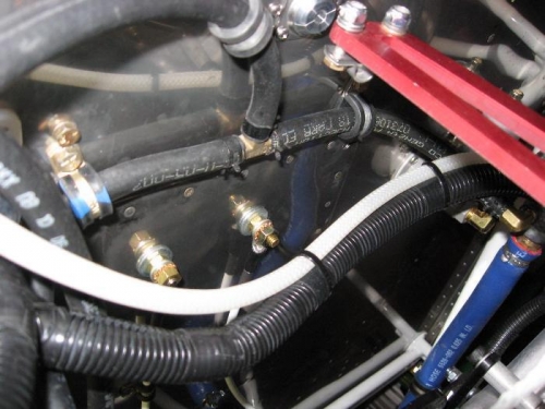 Clamps for the 5/16 water line sharing mounting bolts with wire strip