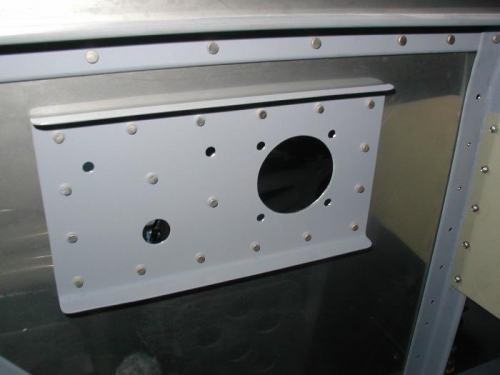 Backing plate riveted in place