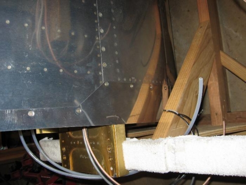 The root fairing on the top of the left wing