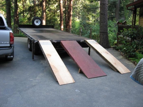 Big trailer that will do the job! (For main wheels, plywood over metal ramp)