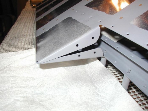 Tabs bent, drilled and primed.