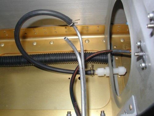 Pitot line connected to bulkhead fitting with wiper washer tubing which expands to fit both lines