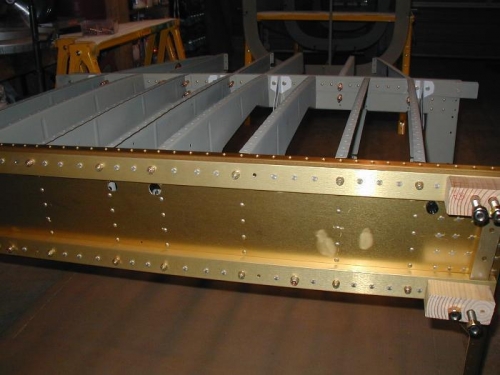 Seat and baggage ribs riveted