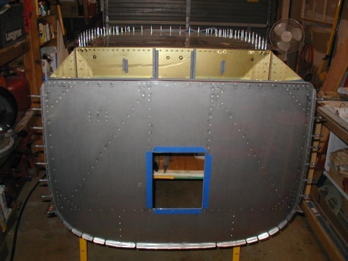 Front upside-down view of firewall cleco-ed to side skins and longerons