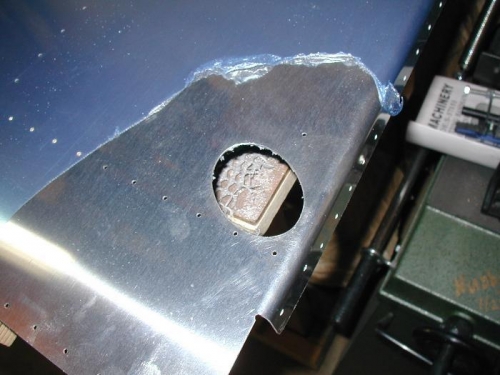 Left side gear leg hole in bottom skin