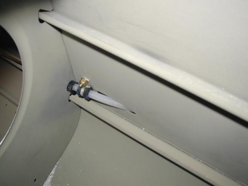 Right side rudder cable passing out through aft fuselage