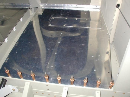 Riveted in place on the left