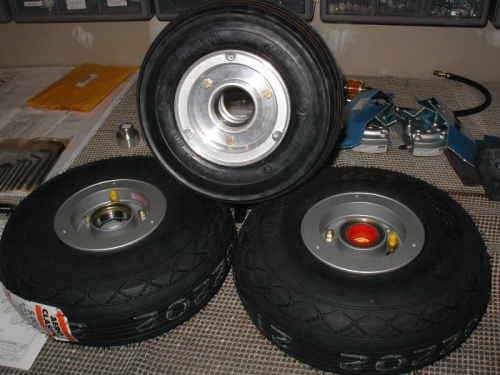 Both mains and the nose wheel tires on rims