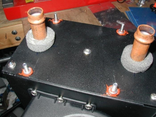 1/8 inch spacers held in place with high temp silicone