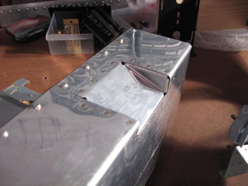 Trough riveted in place