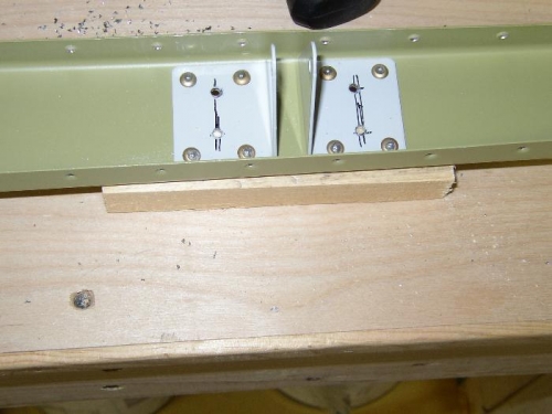 Left side Elevator hinges showing new holes drilled prior to drilling out the bad rivets.