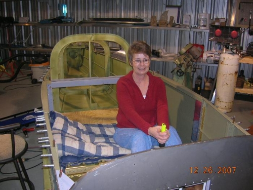 Making airplane noises.