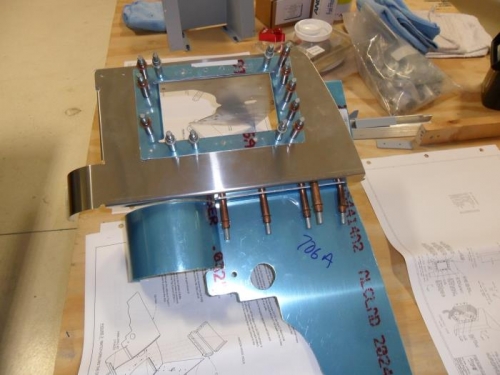 Left rear baffle with opening cut for oil cooler