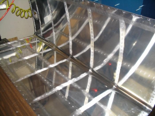 Skin scored to enhance adhesion of sealant