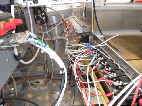 The rat's nest behind the panel