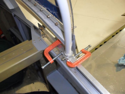 Clamping shims to ensure roller is aligned with track