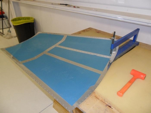 Top aft skin on the dimpling table