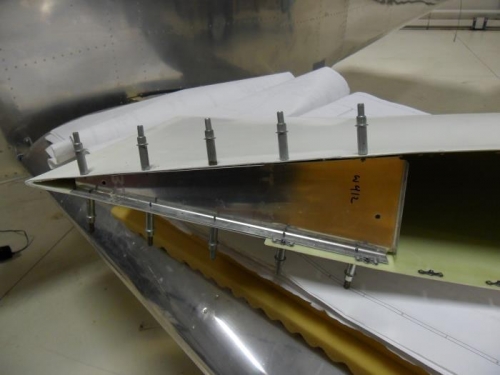 Wing tip rib drilled in place