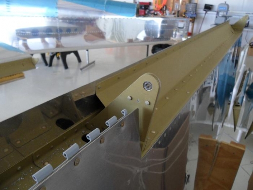 Hole for flap pin drilled in aileron bracket