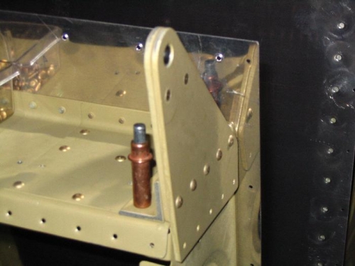 Right wing outboard aileron bracket in position for riveting