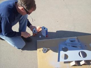 Prepping the fuel tank attach brackets