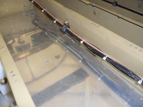 Wiring run under baggage floor