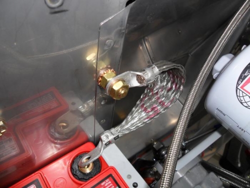 Main grounding strap and firewall ground point