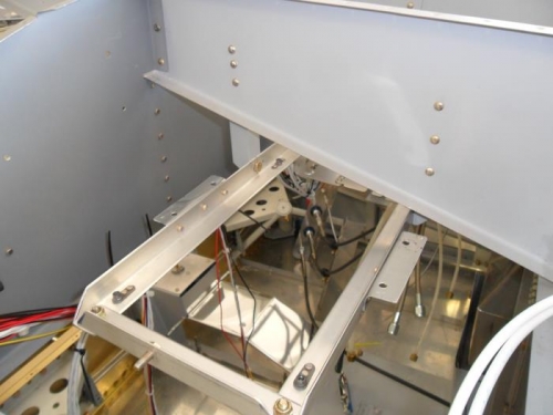 Avionics rack riveted and bolted in place