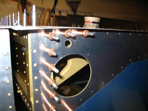 Wing attach point with F-704 pre-riveted in place