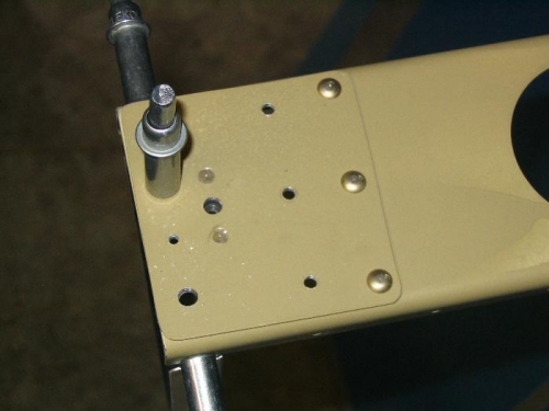 Inboard aileron spar with plate nut riveted in place