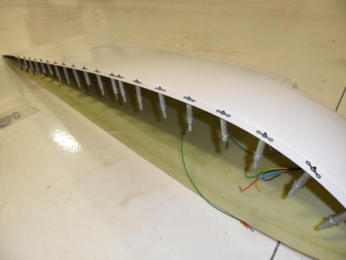 More nutplates, nav light wiring visible in the background