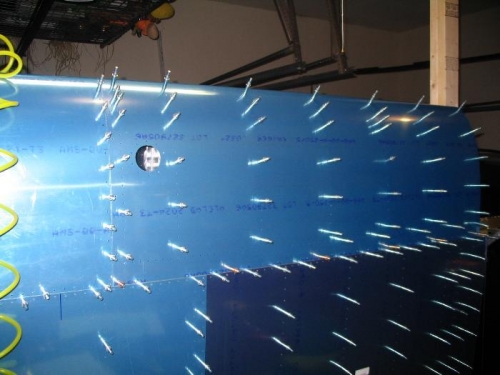 Tank skin clecoed in place