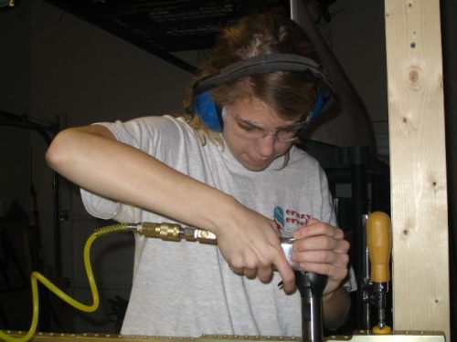 Beth at work with the rivet gun!