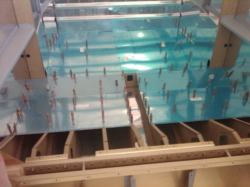 Drilling seat floors to ribs