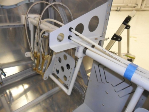 Rudder pedal support bracket and brake lines