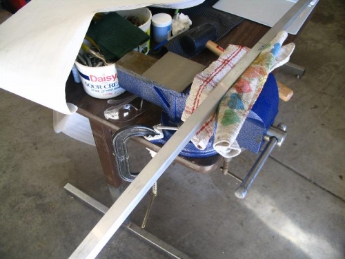 Longerons in vise during bending process