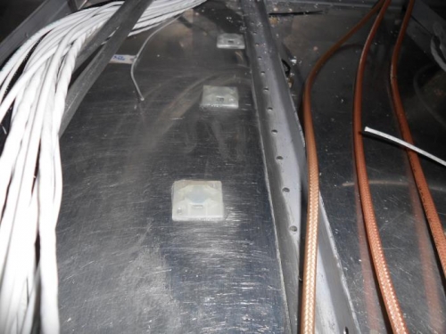 Wire tie bases for securing bundle in tunnel