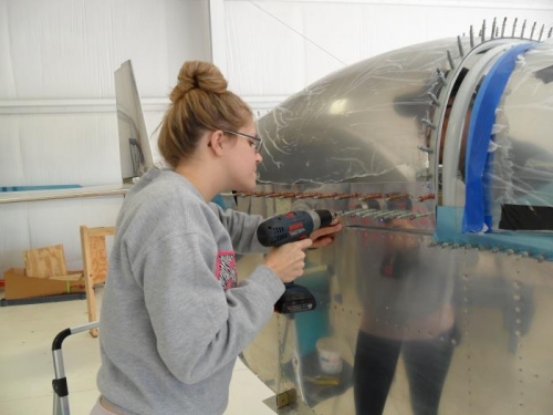 Anna helping drill the skirts