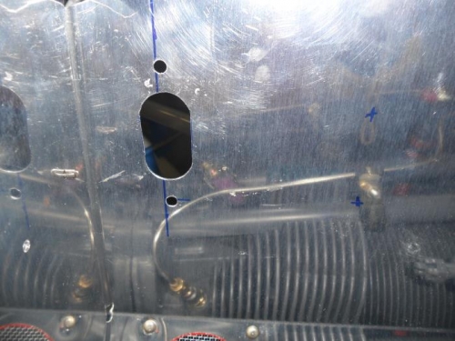 Ignition wire pass-through on the right baffle