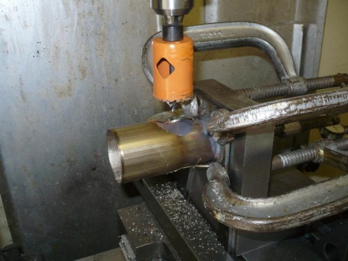 Hold for hole saw operation