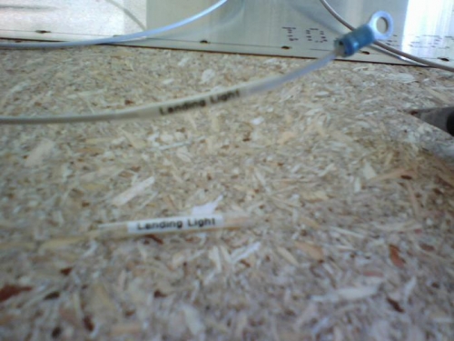 Clear shrink tube over the label