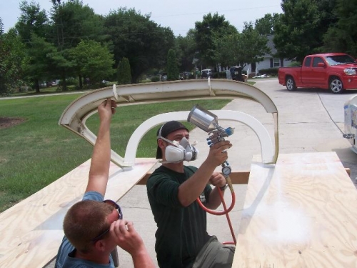 Chris spraying and Will holding